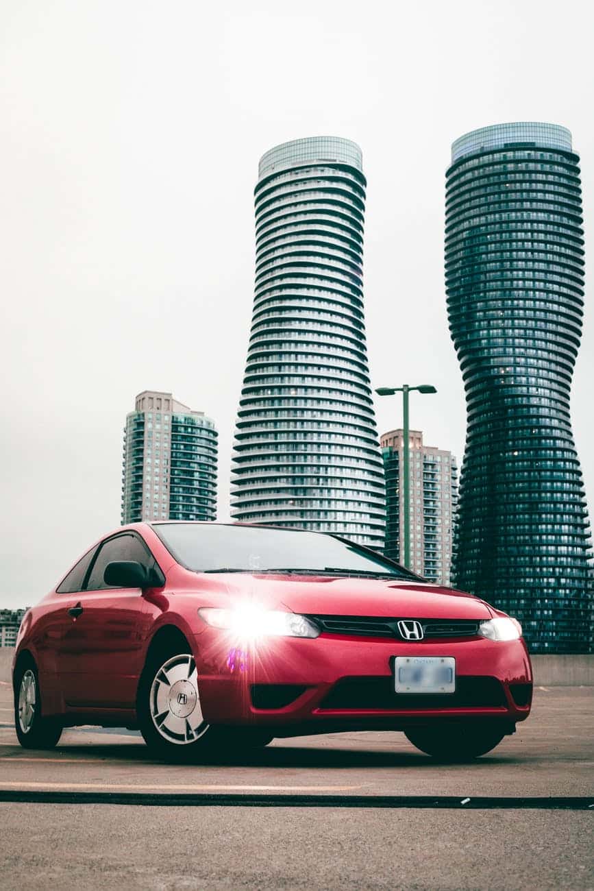 photo of parked red honda